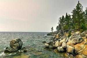 Secret Cove along Lake Tahoe in Nevada with a hazy sky due to nearby forest fires in California. photo