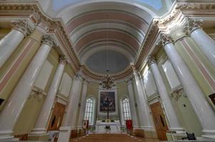 St Petersburg, Russia - July 3, 2018 -  The Catholic Church of St Catherine with monumental arched portal on self-supporting columns, located in Nevsky Prospekt, St Petersburg, Russia. photo