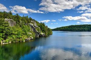 Massive rocks and view to the valley at Minnewaska State Park Reserve Upstate NY during summer time. photo