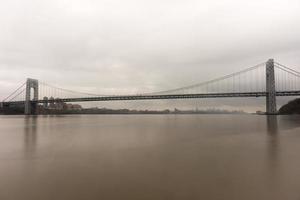 George Washington Bridge crossing the Hudson River on a overcast cloudy day from Fort Lee, New Jersey. photo