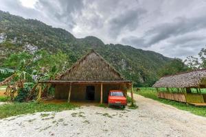 Vinales, Cuba - January 10, 2017 -  Old Russian Lada car parked in a hut in the Vinales valley, north of Cuba. photo