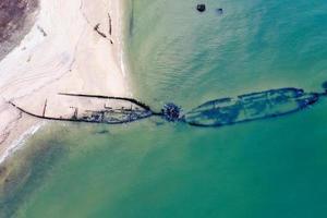 Aerial view of Reeves Beach with the Roanoke Barges shipwreck in Riverhead Long Island, New York. photo