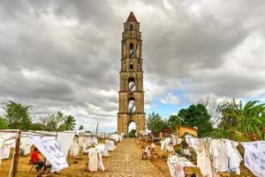 Historic slave watch tower in Manaca Iznaga, Valle de los Ingenios, Trinidad, Cuba. The Manaca Iznaga Tower is the tallest lookout tower ever built in the Caribbean sugar region. photo