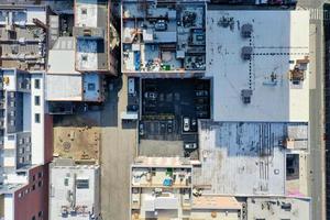 Top down aerial view of buildings and a parking lot in Williamsburg, Brooklyn, New York. photo