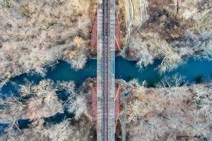 Moodna Viaduct Trestle. The Moodna Viaduct is an iron railroad trestle spanning Moodna Creek and its valley at the north end of Schunemunk Mountain in Cornwall, New York. photo