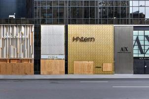 New York City, New York - June 11, 2020 -  Store closed during the COVID-19 pandemic, with boarded up windows to protect against looting as a result of anti-police brutality protests. photo