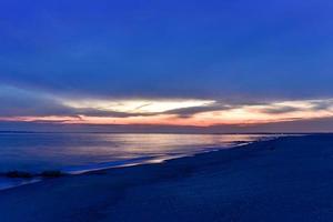 Dramatic sunset at Coney Island beach in Brooklyn, New York. photo