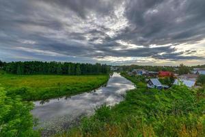 Panoramic view along the Kamenka River in Suzdal, Russia in the Golden Ring. photo