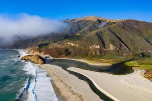 Ocean fog rolling in onto Highway 1 and Big Sur, California, USA photo