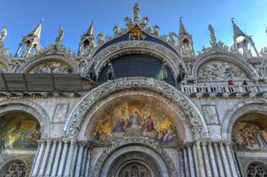 Saint Mark's Square in Venice Italy. It is the principal public square of Venice, Italy, where it is generally known just as la Piazza. photo