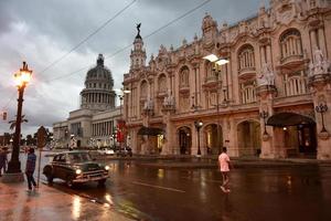 Havana, Cuba - January 7, 2017 -  Historic Hotel Inglaterra near the Central Park in Havana, Cuba with the Capitolio in the National Capital Building in the background. photo