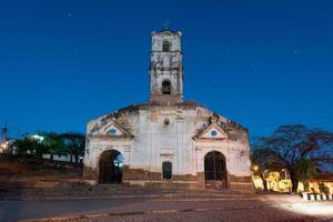 Ruins of the colonial catholic church of Santa Ana in Trinidad, Cuba at night. photo