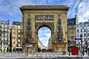 Paris, France - May 16, 2017 -  The Porte Saint-Denis, built in 1672, designed by architect Francois Blondel at the order of Louis XIV in Paris, France. photo