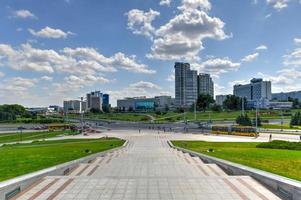 Skyline of the city of Minsk, Belarus with sign inscribing it as Hero City for its time during WW II. photo