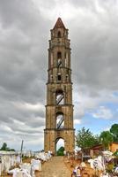 Historic slave watch tower in Manaca Iznaga, Valle de los Ingenios, Trinidad, Cuba. The Manaca Iznaga Tower is the tallest lookout tower ever built in the Caribbean sugar region. photo