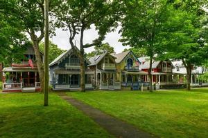 Martha's Vineyard, MA - July 5, 2020 -   Carpenter Gothic Cottages with Victorian style, gingerbread trim in Oak Bluffs on Martha's Vineyard, Massachusetts, USA. photo