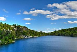 Massive rocks and view to the valley at Minnewaska State Park Reserve Upstate NY during summer time. photo