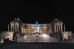 The monument to Victor Emmanuel II. Altar of the Fatherland. Piazza Venezia in Rome, Italy at night. photo