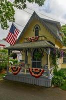 Martha's Vineyard, MA - July 5, 2020 -   Carpenter Gothic Cottages with Victorian style, gingerbread trim in Oak Bluffs on Martha's Vineyard, Massachusetts, USA. photo