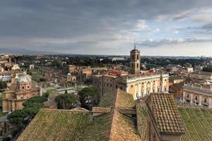 Aerial view of the skyline of Rome, Italy as sunset approaches. photo