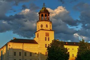 View of the white building of the Museum of Salzburg situated in the neue Residenz Building and the residenzbrunnen fountain on the residenzplatz. photo