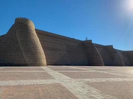 Wall of the Bukhara Fortress, Uzbekistan. The Ark of Bukhara is a massive fortress located in the city of Bukhara, Uzbekistan that was initially built and occupied around the 5th century AD. photo
