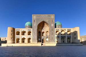 Ancient Mir-i-Arab Madrasa in the Po-i-Kalyan complex in Bukhara, Uzbekistan. photo