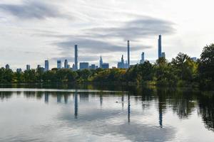 View across the New York City skyline from Central Park across the Jacqueline Kennedy Onassis Reservoir. photo