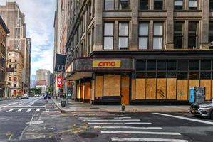 New York City, New York - June 11, 2020 -  Store closed during the COVID-19 pandemic, with boarded up windows to protect against looting as a result of anti-police brutality protests. photo