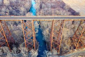 Moodna Viaduct Trestle. The Moodna Viaduct is an iron railroad trestle spanning Moodna Creek and its valley at the north end of Schunemunk Mountain in Cornwall, New York. photo