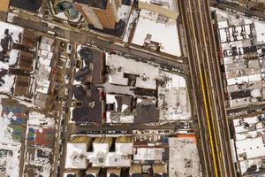 Aerial view of a snow covered roofs of buildings in Brighton Beach during the winter in Brooklyn, New York photo