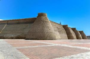 Wall of the Bukhara Fortress, Uzbekistan. The Ark of Bukhara is a massive fortress located in the city of Bukhara, Uzbekistan that was initially built and occupied around the 5th century AD. photo