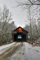 Martin's Mill Covered Bridge in Hartland, Vermont during the winter. photo
