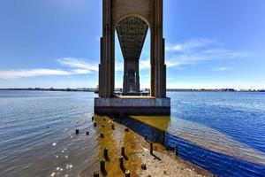 The Outerbridge Crossing is a cantilever bridge which spans the Arthur Kill. The Outerbridge, as it is often known, connects Perth Amboy, New Jersey, with Staten Island, NY. View from underneath. photo