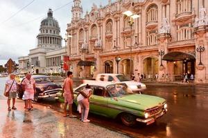 Havana, Cuba - January 7, 2017 -  Historic Hotel Inglaterra near the Central Park in Havana, Cuba with the Capitolio in the National Capital Building in the background. photo