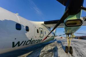 Leknes, Norway - February 26, 2016 -   Wideroe Airplane at Leknes Airport in the Lofoten Islands, Norway. photo