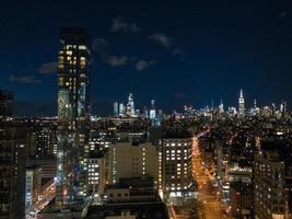 Aerial view of Midtown Manhattan from downtown in Manhattan, New York City at night. photo