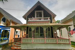 Martha's Vineyard, MA - July 5, 2020 -   Carpenter Gothic Cottages with Victorian style, gingerbread trim in Oak Bluffs on Martha's Vineyard, Massachusetts, USA. photo