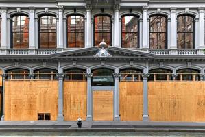 New York City, New York - June 11, 2020 -  Store closed during the COVID-19 pandemic, with boarded up windows to protect against looting as a result of anti-police brutality protests. photo