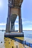 The Outerbridge Crossing is a cantilever bridge which spans the Arthur Kill. The Outerbridge, as it is often known, connects Perth Amboy, New Jersey, with Staten Island, NY. View from underneath. photo