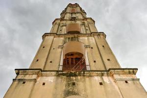 Historic slave watch tower in Manaca Iznaga, Valle de los Ingenios, Trinidad, Cuba. The Manaca Iznaga Tower is the tallest lookout tower ever built in the Caribbean sugar region. photo