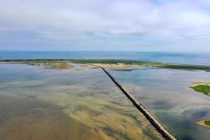 Provincetown Causeway also known as the Breakwater Walk, is an uneven collection of rocks that allows hikers to cross the harbor and reach the very tip of the Cape. photo