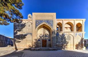 Khoja-Gaukushan Madrasa in the historic center of Bukhara, Uzbekistan. photo
