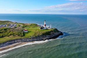 Aerial view of the Montauk Lighthouse and beach in Long Island, New York, USA. photo