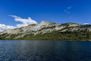 Views of Tenaya Lake, an alpine lake in Yosemite National Park, located at an elevation of 2,484 m photo