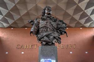 Saint Petersburg, Russia - June 30, 2018 -  Bust of Emperor Peter the First at Moscow railway station with a Saint-Petersburg logo on the wall in the background. photo