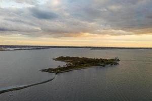 The Rose Island Light, built in 1870, is on Rose Island in Narragansett Bay in Newport, Rhode Island in the United States. photo