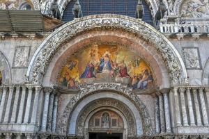 Saint Mark's Square in Venice Italy. It is the principal public square of Venice, Italy, where it is generally known just as la Piazza. photo