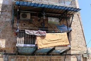 Balcony - a platform with railings protruding on the upper floors of the building. photo