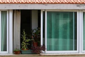 A small window in a residential building in a big city photo